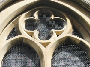 Close up view of the guards shows the quatrefoil tracery and insets Close up view of the traditional window guards shows the quatrefoil tracery and insets