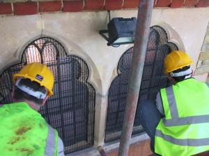 AIANO engineers fitting church window guards AIANO engineers installing church window guards